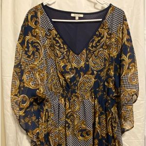 New (never worn) multi-colored knee length dress with billowy sleeves by MPH.